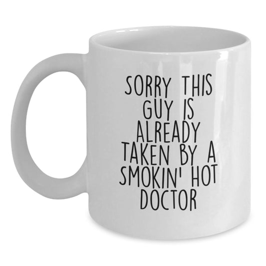 Funny Doctor Gifts from Men to Women Friends Coworkers Family - White Coffee Mug with Sorry This Guy Is Already Taken By A Smokin' Hot Doctor Quote - Christmas Unique Gifts - Main