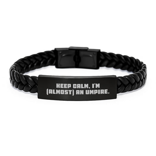 Funny Umpire Gifts for Men, Valentine's Unique Umpire Accessories, Interlaced Leather Bracelet with Stainless Steel Engraved Umpire Quote 'Keep Calm, I'm (almost) An Umpire.' from Friend or Family - Image 1