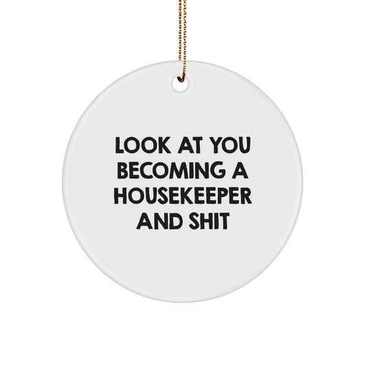 Funny Housekeeper Gifts from Men to Women, 'Look At You Becoming A Housekeeper And Shit' Christmas Unique Circle Ornament, White Color, Durable MDF - Image 1