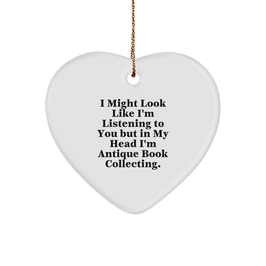 Funny Antique Book Collecting Gifts from Friends for Christmas: 'I Might Look Like I'm Listening...' Heart Ornament - Image 1