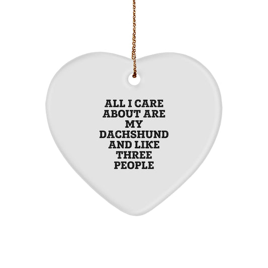 Dachshund Dog Lover Gifts from Family Christmas Heart Ornament, Funny Quote Gift for Dachshund Dog Owners, 'All I Care About Are My Dachshund And Like Three People' Heart Shaped Ornament - Image 1