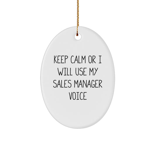 Funny Sales Manager Gifts from Friends for Christmas Unique Oval Ornament, 'Keep Calm Or I Will Use My Sales Manager Voice', White Oval Shaped Decorations with Gold Cord - Image 1