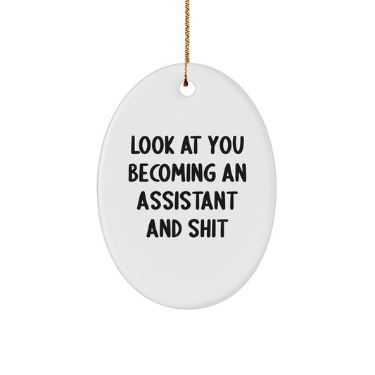 Funny Christmas Unique Gifts from Men for Assistant - Oval Ornament, Look At You Becoming An Assistant And Shit, Cute Assistant - Image 1