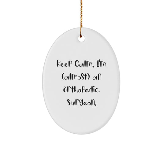 Funny Orthopedic Surgeon Gifts from Friends and Family for Men - Oval Ornament with 'Keep Calm, I'm (almost) An Orthopedic Surgeon.' Quote - Christmas Unique - Image 1
